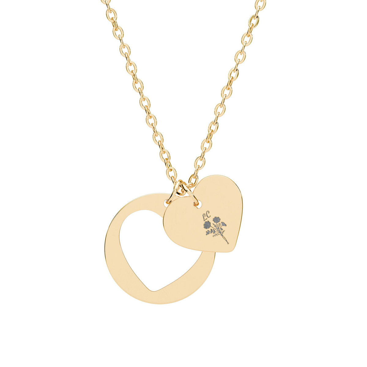 Gold heart cutout pendant necklace with engraved emblem, linked chain