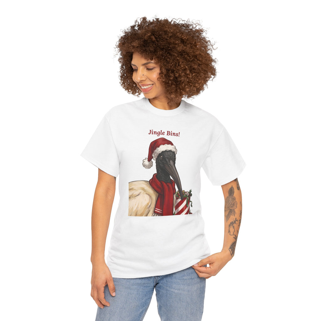 White graphic T-shirt with ibis in Santa hat and “Jingle Bins!” front print worn by woman.