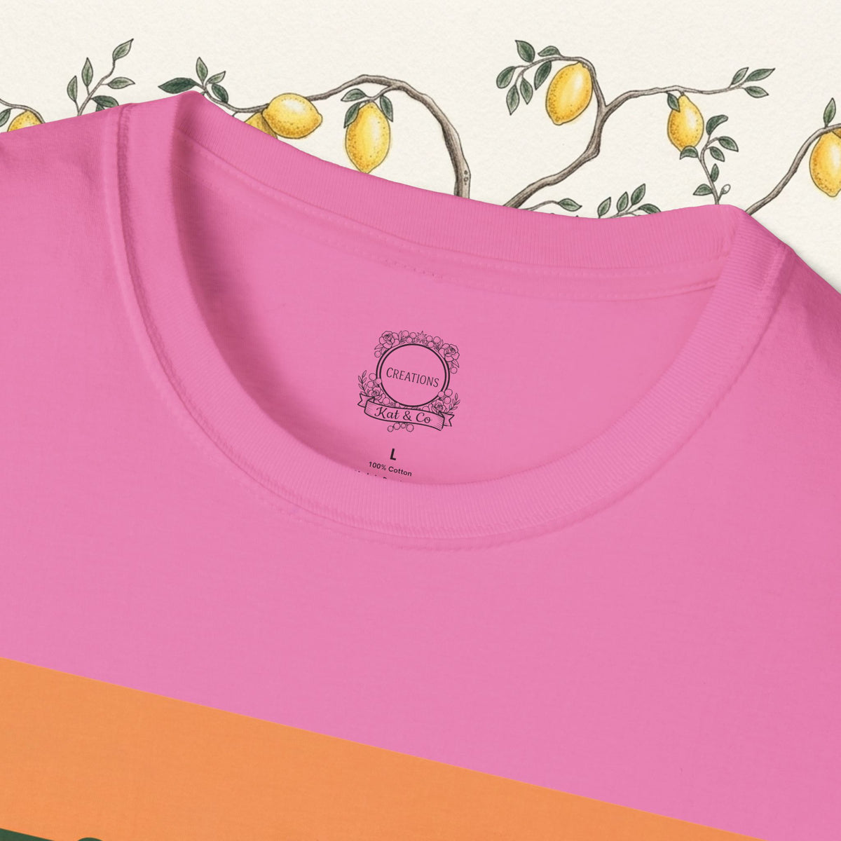 Pink crewneck t-shirt close-up of neckline with small brand label