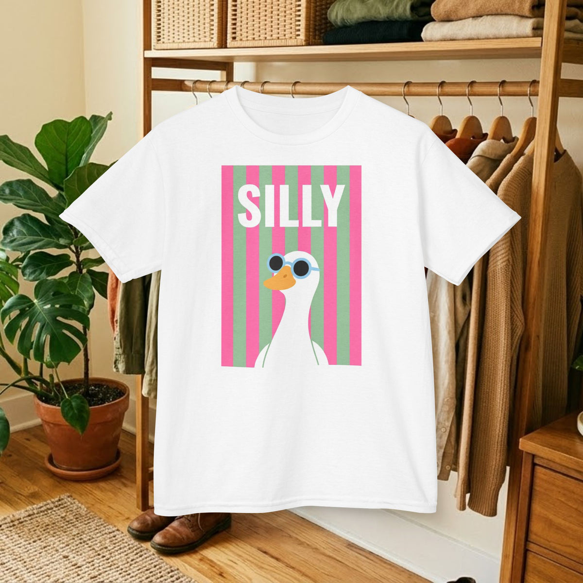 White kids T-shirt with large front “SILLY” duck graphic in pink striped panel