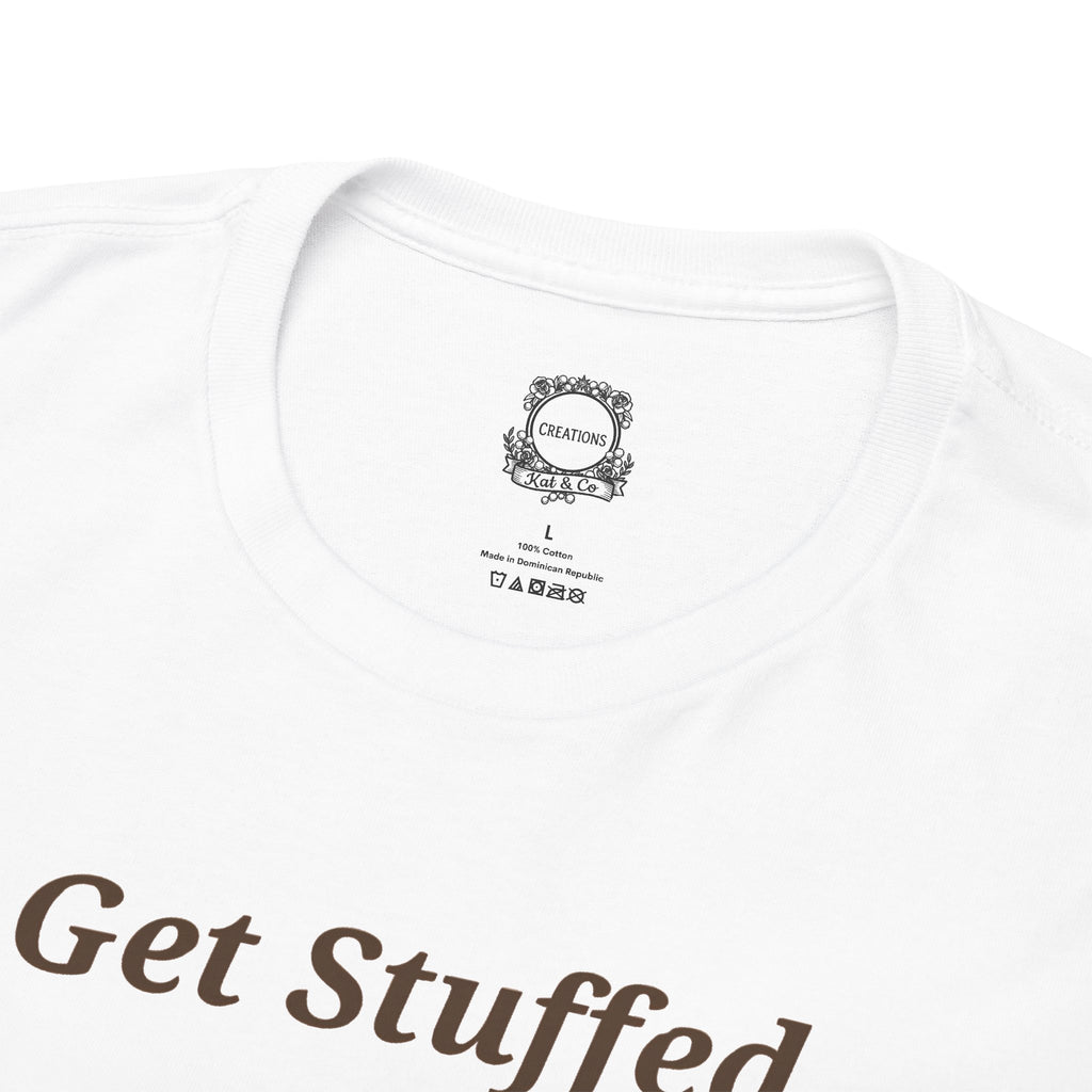 Back of white tee showing small neck label and badge at the collar