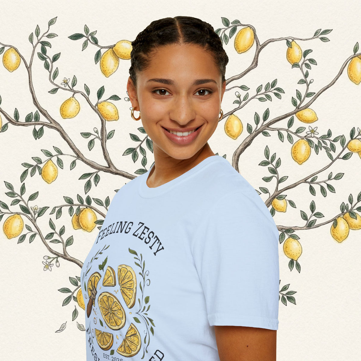Light blue crewneck graphic tee on model, side view of citrus print and "FEELING ZESTY"
