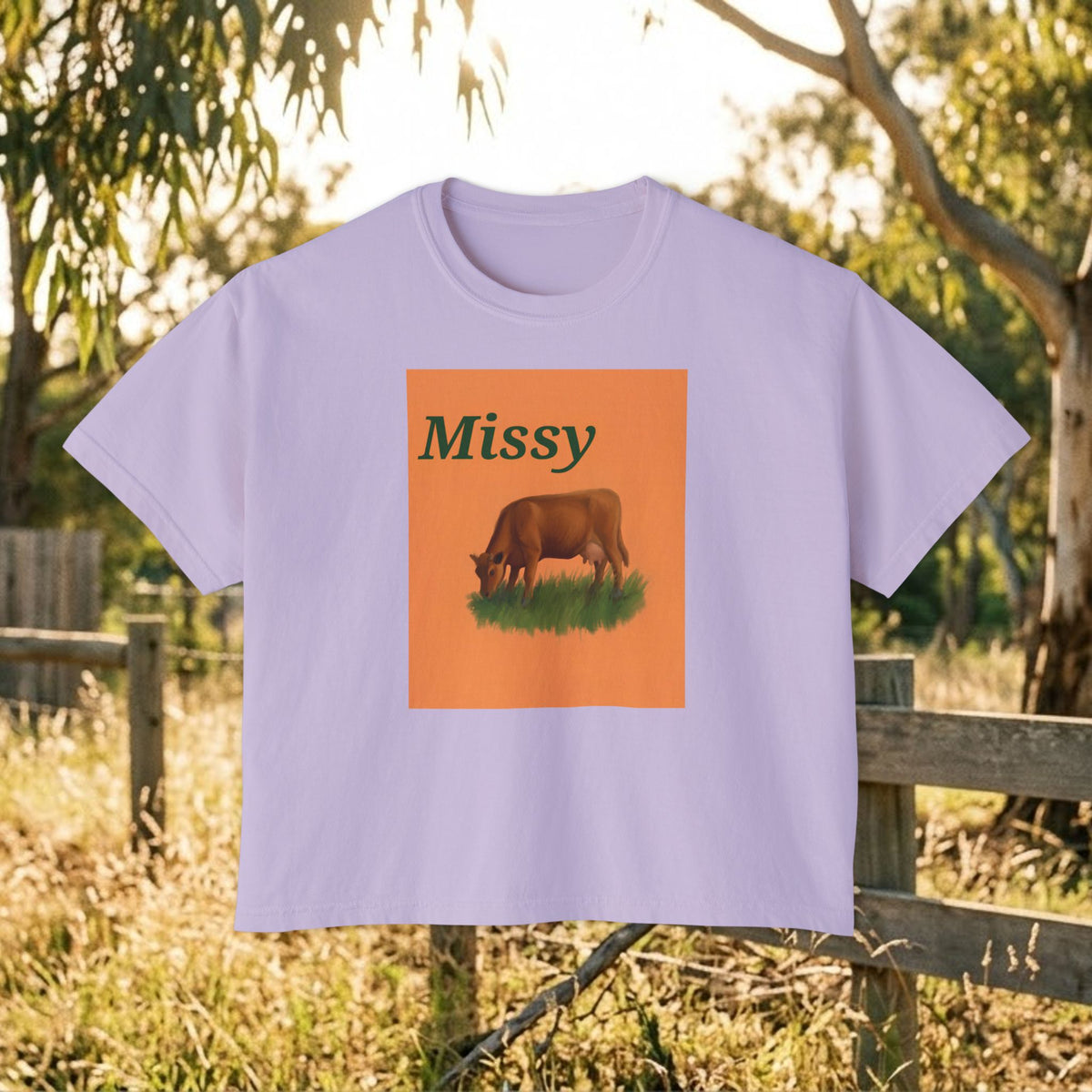 Lavender boxy crewneck T-shirt with Missy grazing cow graphic