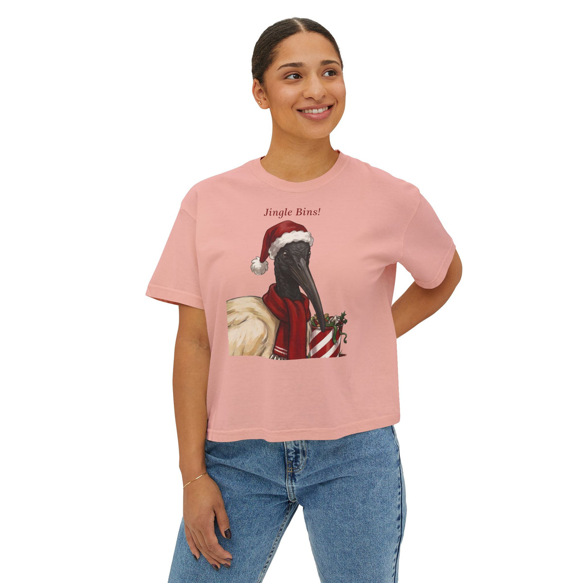 Peachy pink crewneck T-shirt with front “Jingle Bins!” crow in Santa hat graphic