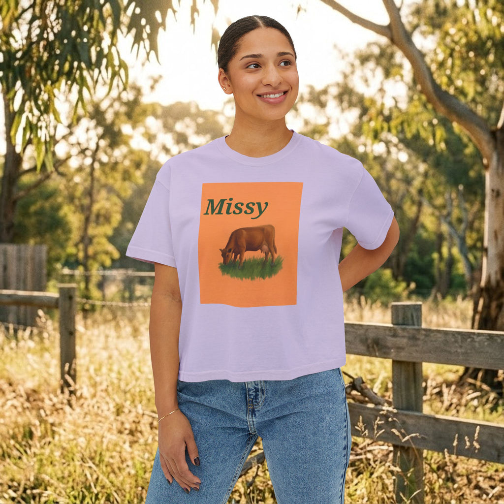 Lavender boxy crewneck T-shirt with Missy grazing cow graphic on model