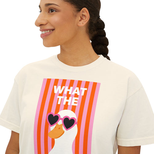 Ivory crew-neck graphic tee with “WHAT THE” text and duck wearing heart glasses