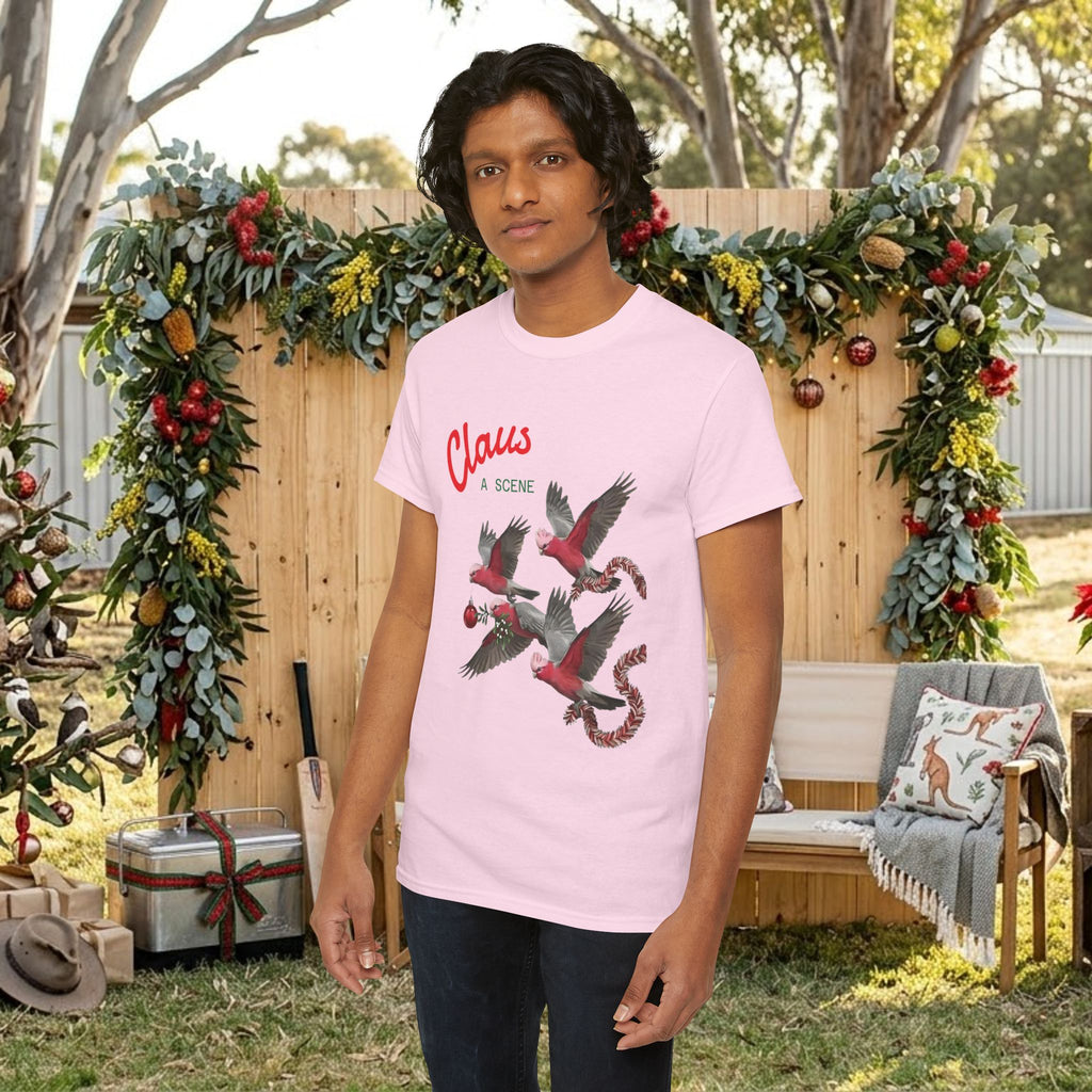 Light pink Christmas T-shirt with “Claus” text and flying bird graphic on chest