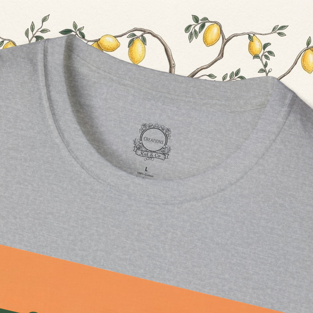 Heather grey T-shirt close-up with small chest label and orange graphic edge