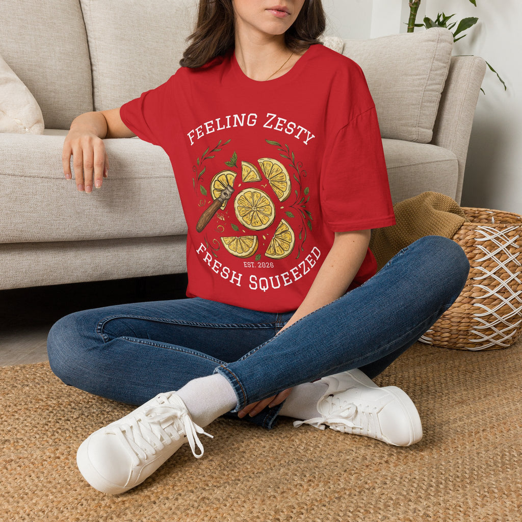 Red graphic lemon slice t-shirt worn with blue jeans and white sneakers