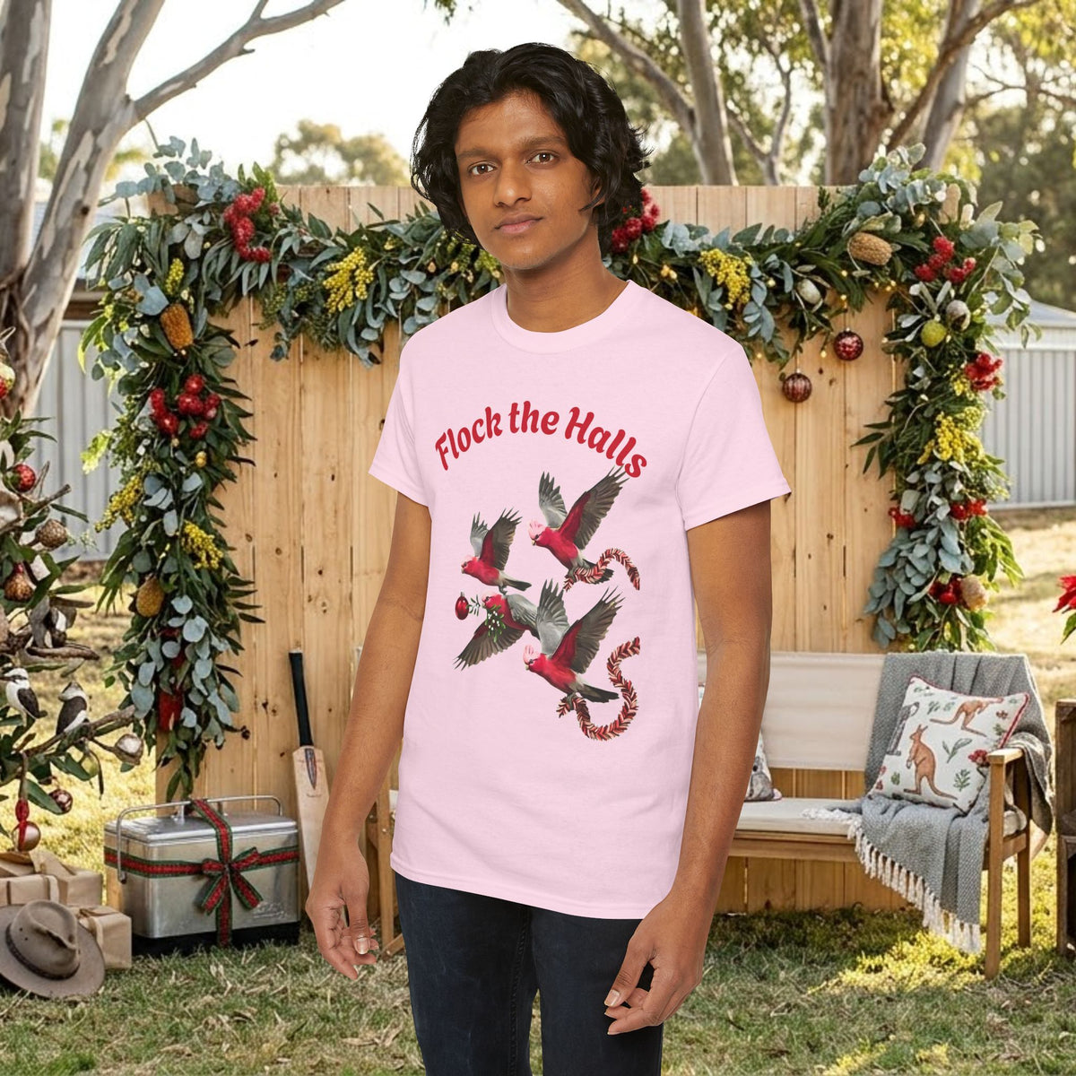 Light pink crew-neck T-shirt with cardinal bird print and red “Flock the Halls” text