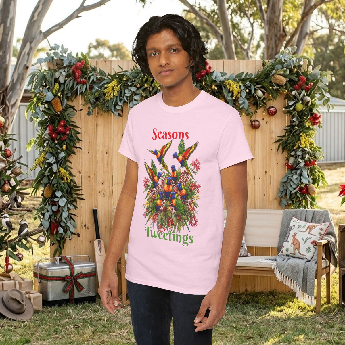Light pink T-shirt with colorful bird floral holiday graphic and 'Seasons Tweetings' text