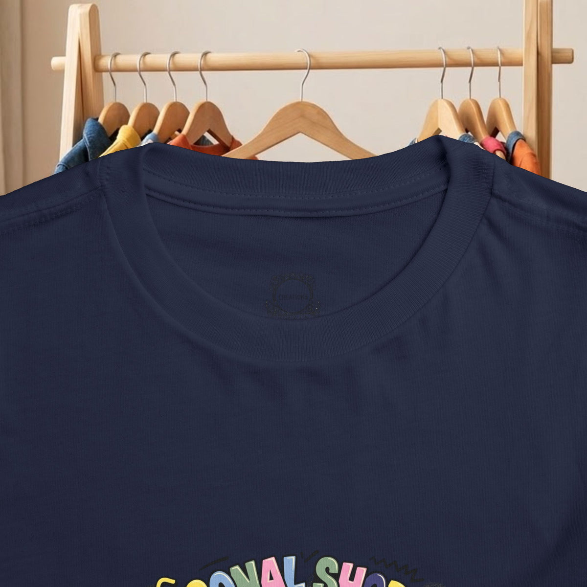 Navy toddler T-shirt close-up of crew neck and shopping cart graphic