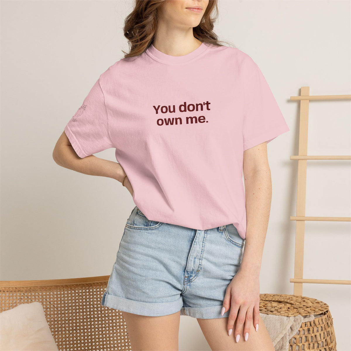 Light pink graphic T-shirt with "You don't own me." text printed on the front.