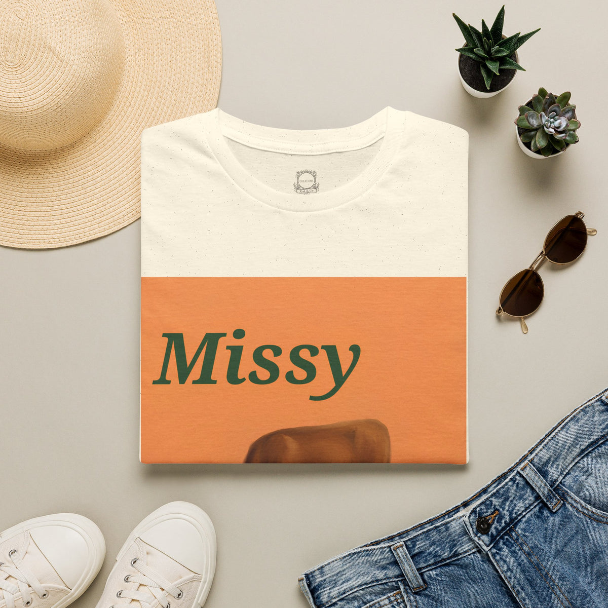 White short-sleeve T-shirt front with “Missy” orange panel and cow graphic