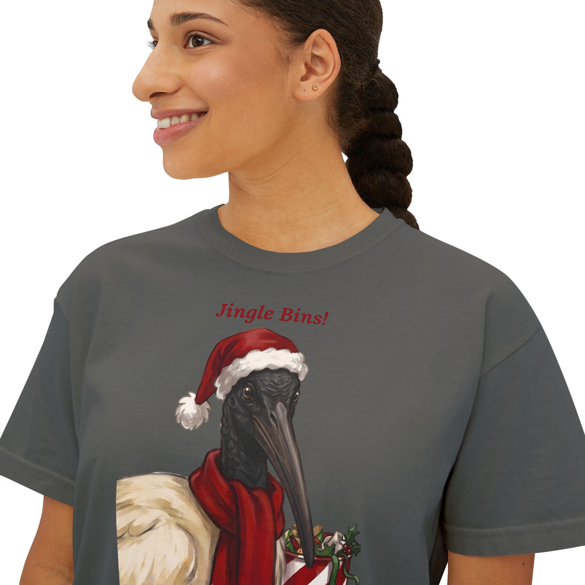 Dark gray T-shirt close-up: “Jingle Bins!” text with crow wearing Santa hat
