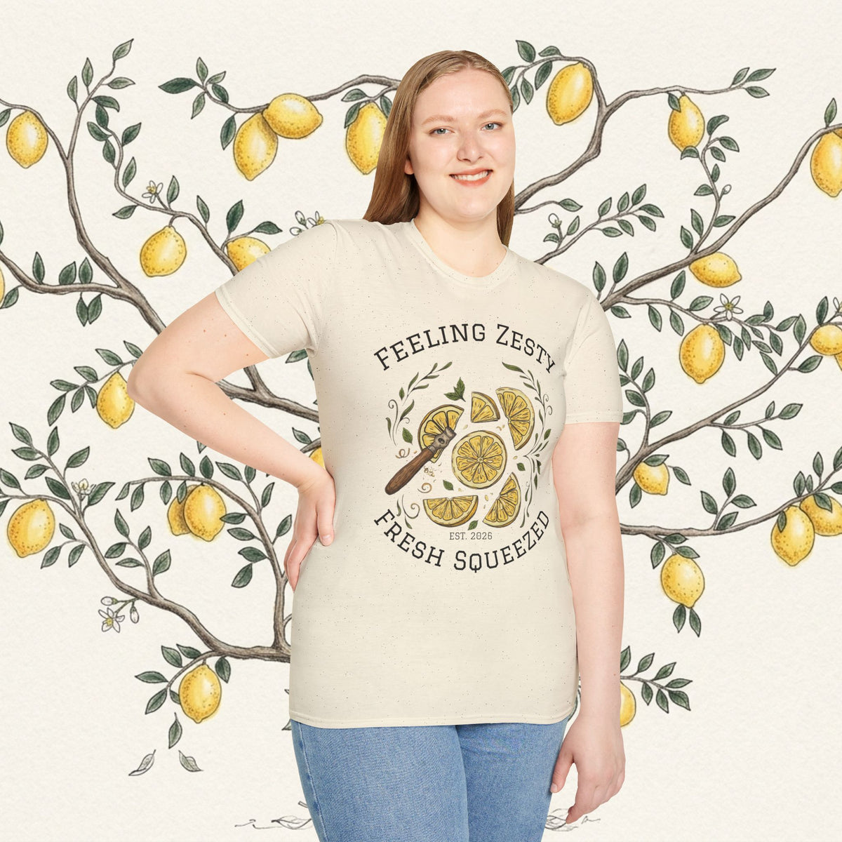 Cream short-sleeve graphic tee with lemon slice and “Feeling Zesty” text