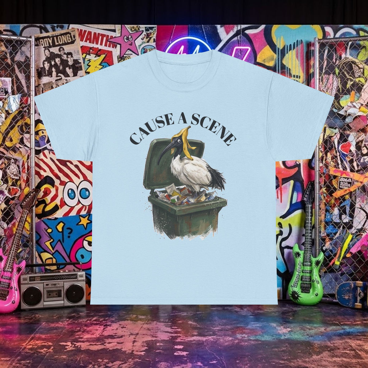 Light blue T-shirt with ibis in a trash can graphic and "CAUSE A SCENE" text