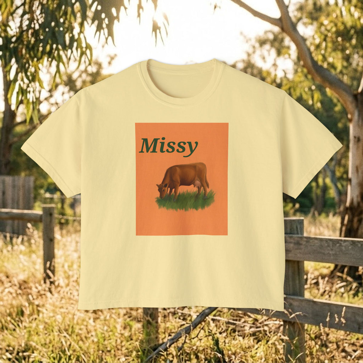 Women’s boxy graphic tee in ivory with 'Missy' cow illustration on front