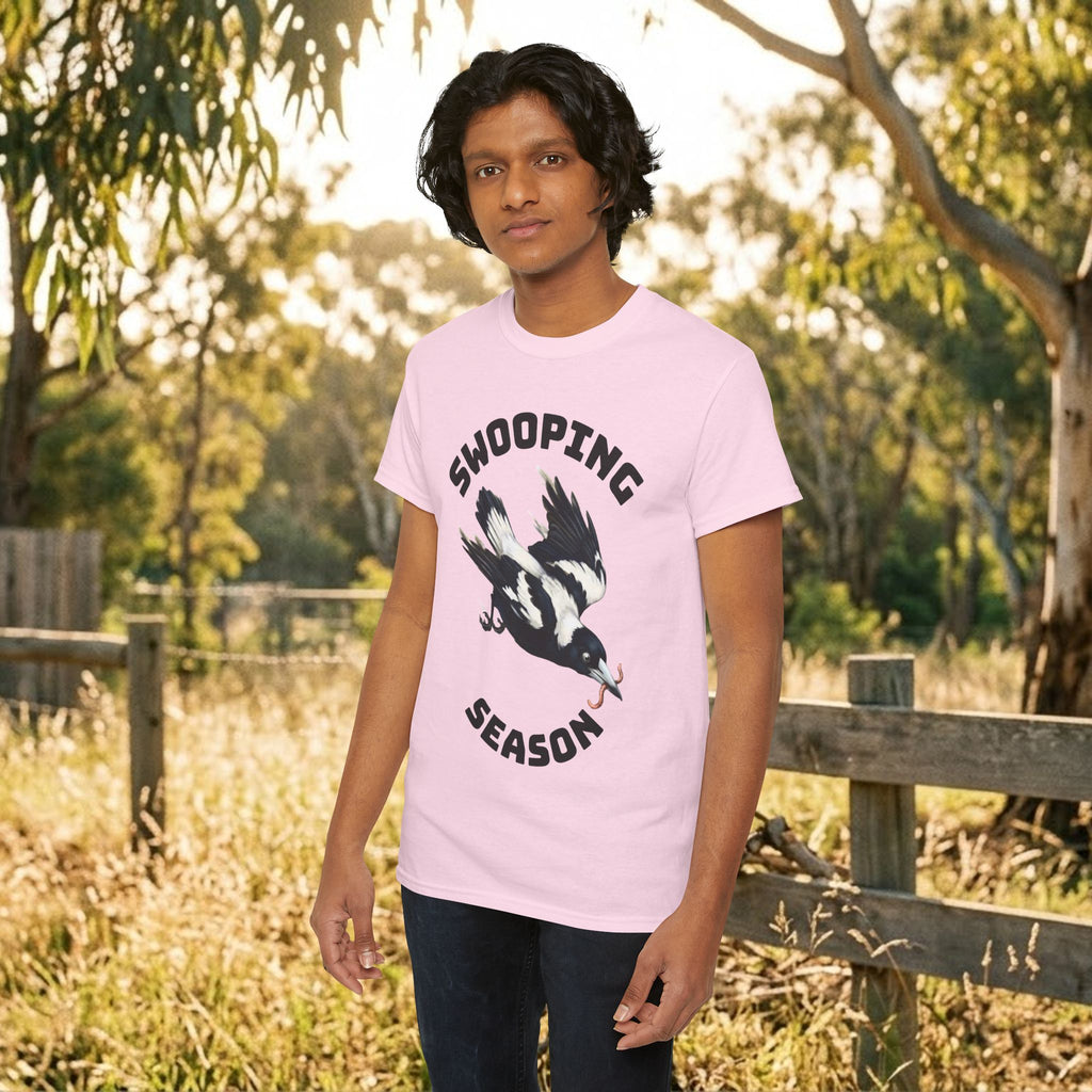 Light pink bird graphic t-shirt with flying bird and bold stacked text on chest