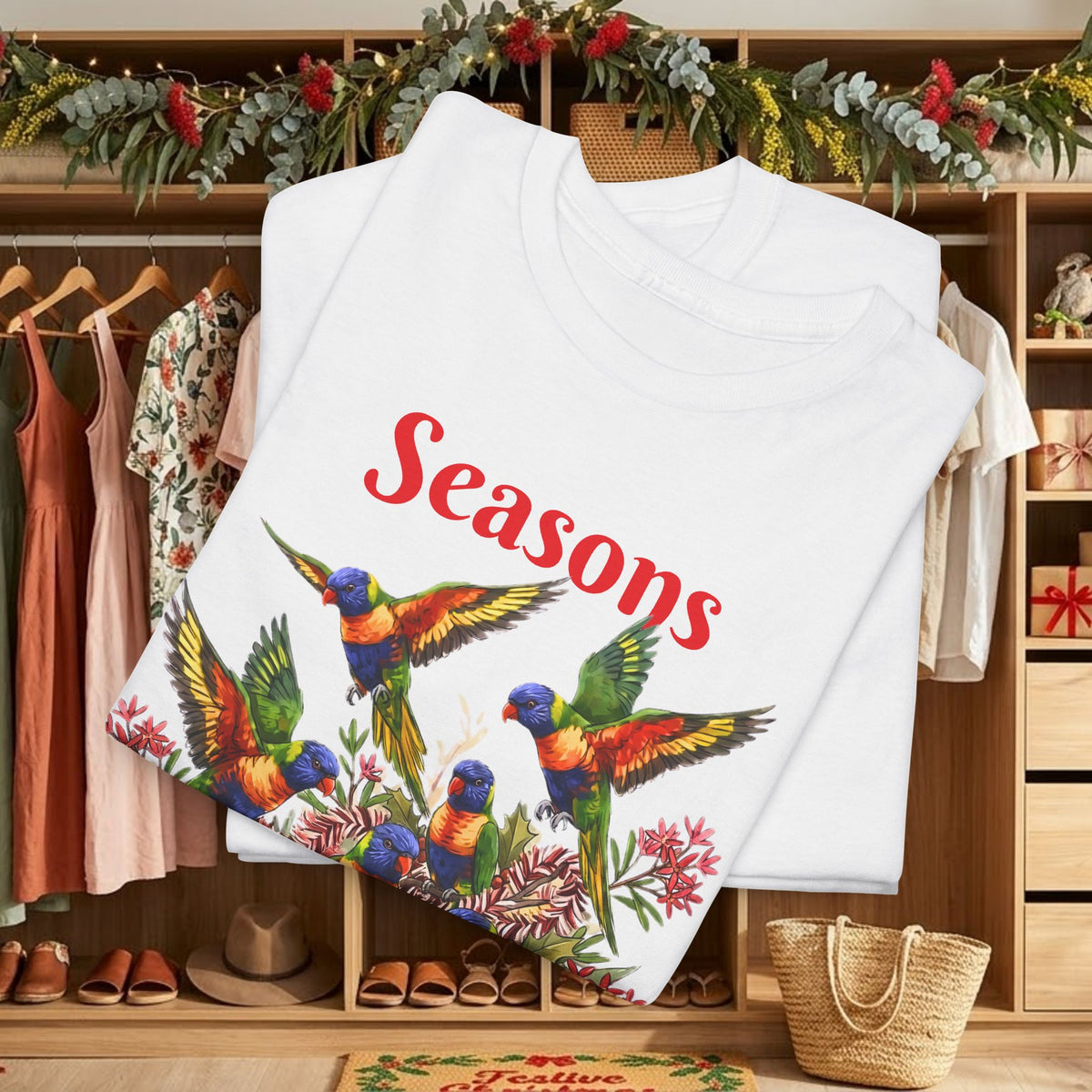 White T-shirt on hanger with 'Seasons' bird floral graphic and 'Tweetings' text