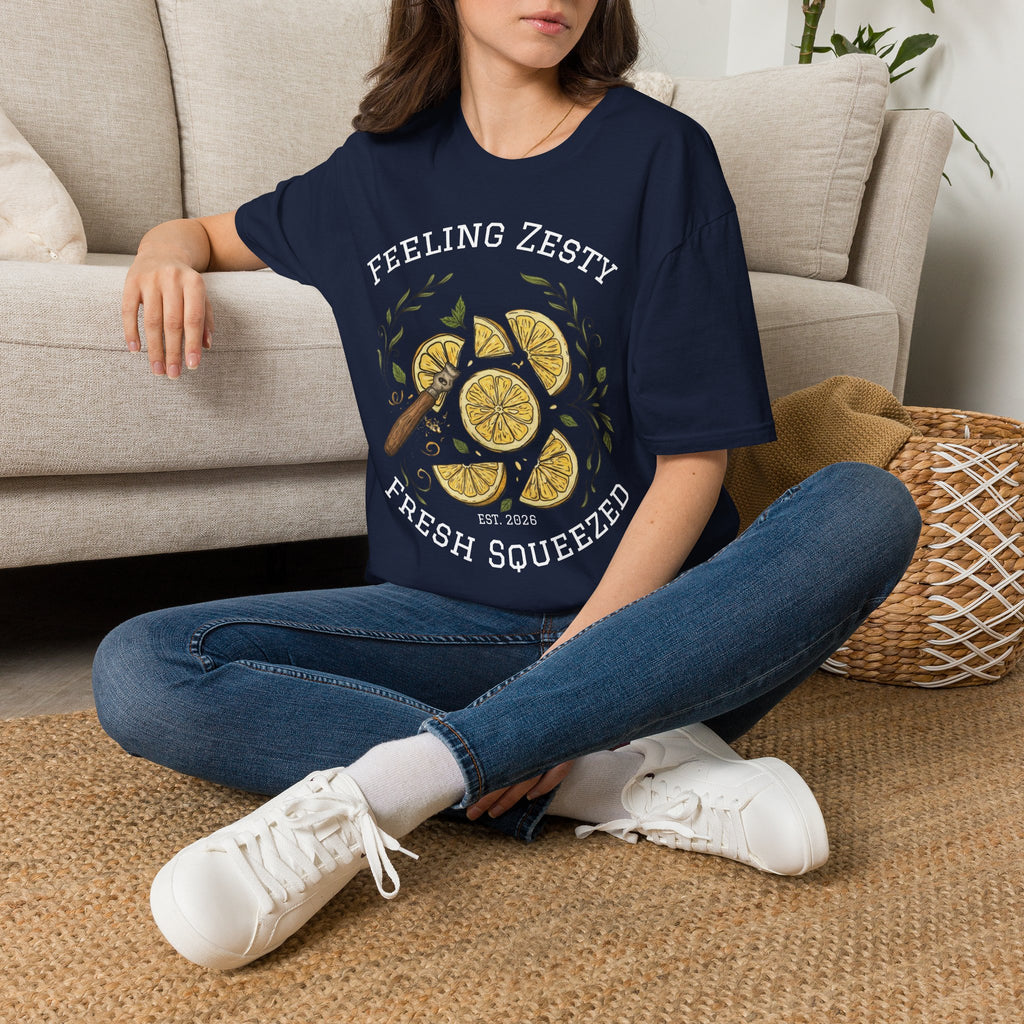 Navy graphic lemon slice T-shirt on seated person, “FRESH SQUEEZED” visible