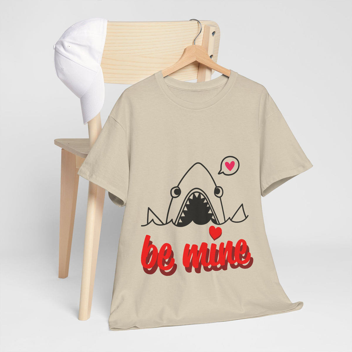 Sand T-shirt with shark graphic, pink heart accents, and “be mine” slogan