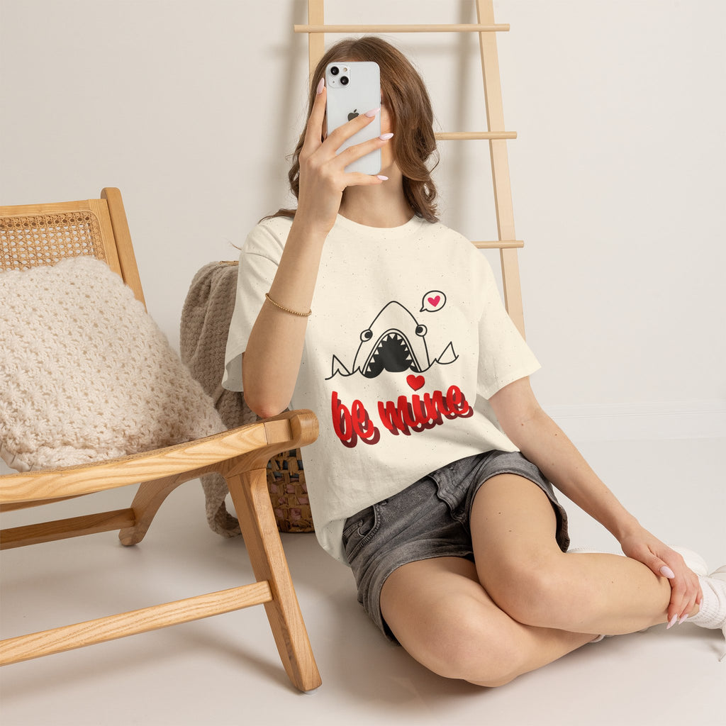 Light cream T-shirt with shark graphic and red 'be mine' lettering with heart accents.