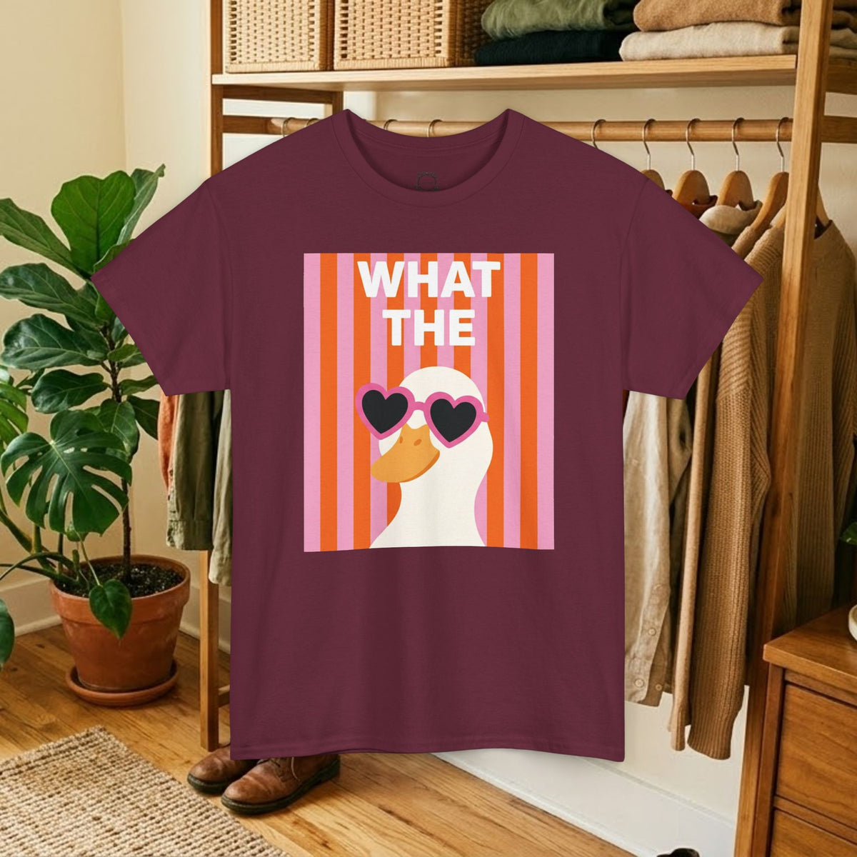 Maroon cotton crewneck graphic tee with “WHAT THE” striped portrait and heart sunglasses.