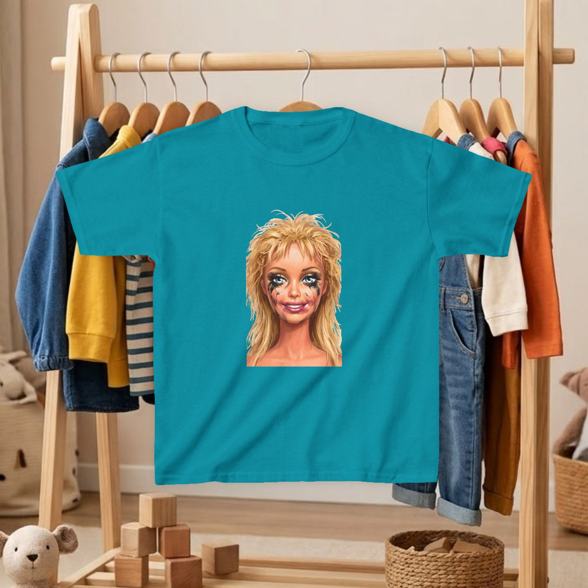 Kids' T-shirt in teal with blonde doll portrait graphic on front