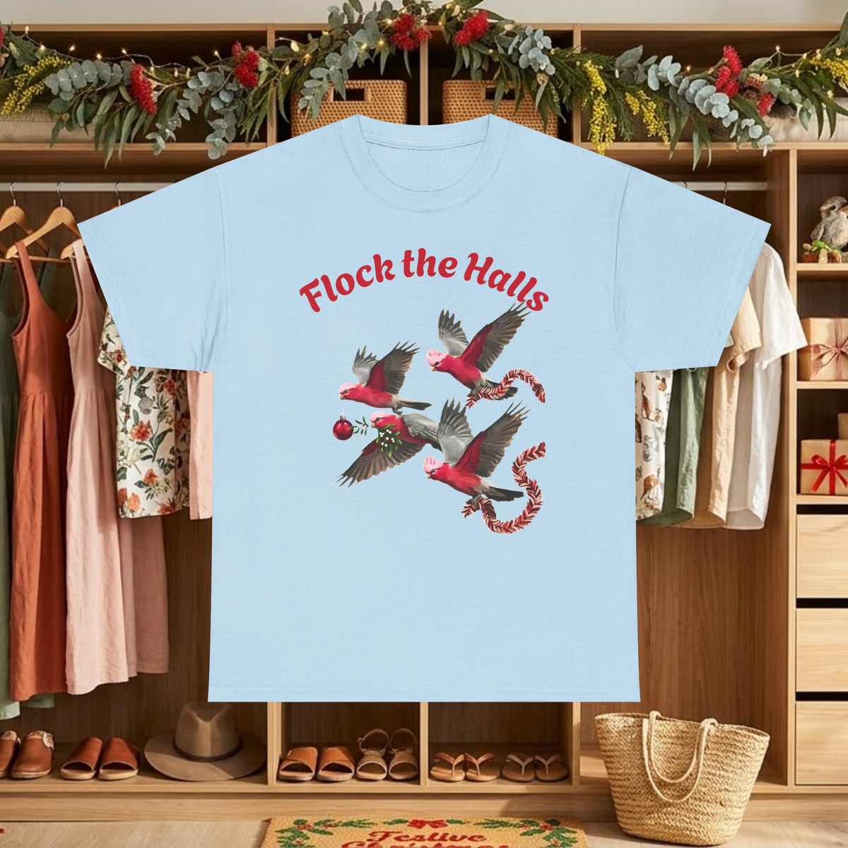 Light blue Christmas cardinals graphic t-shirt with “Flock the Halls” text and birds