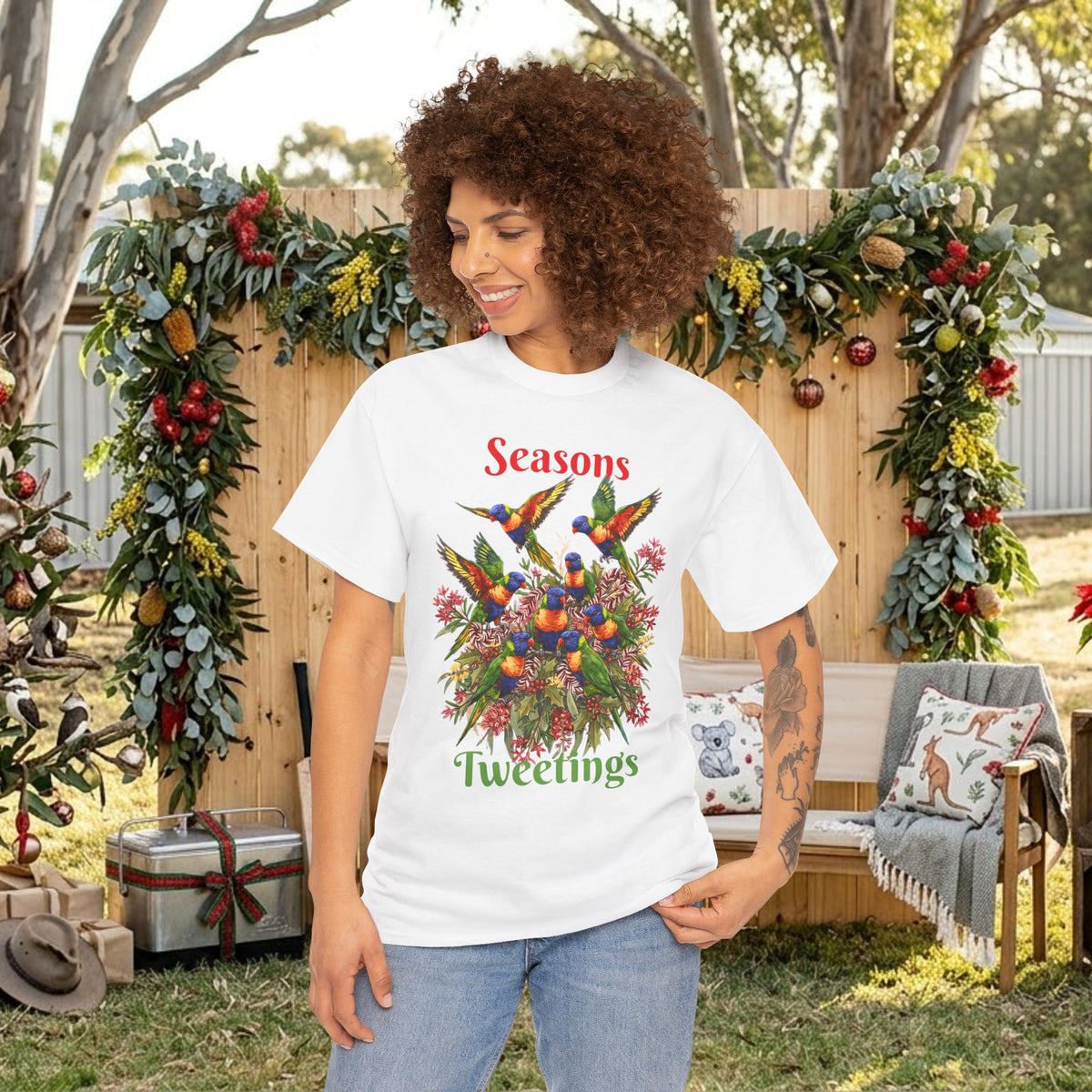 White T-shirt with colorful birds floral holiday design and 'Seasons Tweetings' text