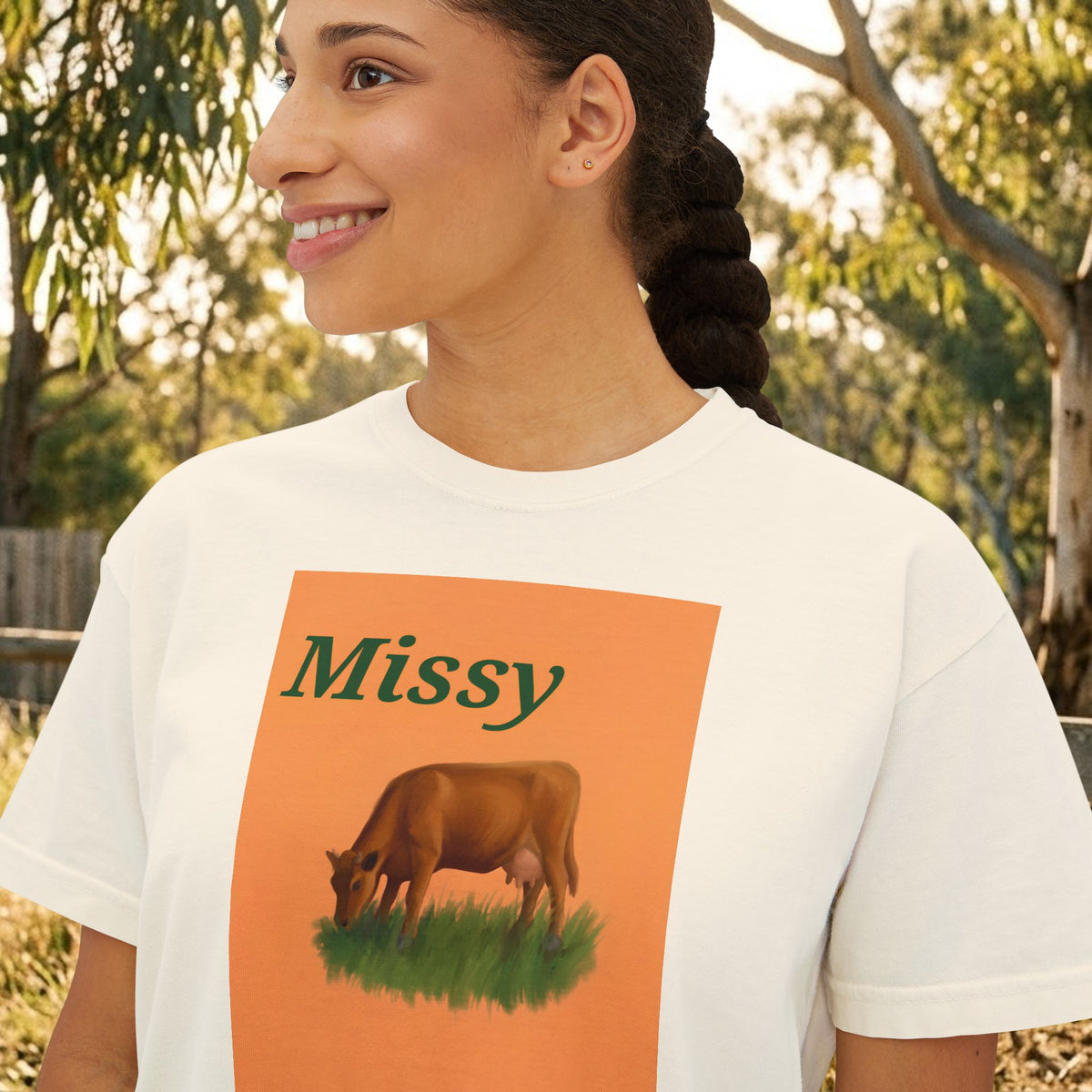 Women’s boxy graphic tee in cream with 'Missy' cow illustration on front