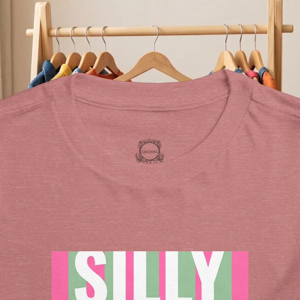 Toddler mauve T-shirt with small backneck logo and partial “SILLY” duck graphic