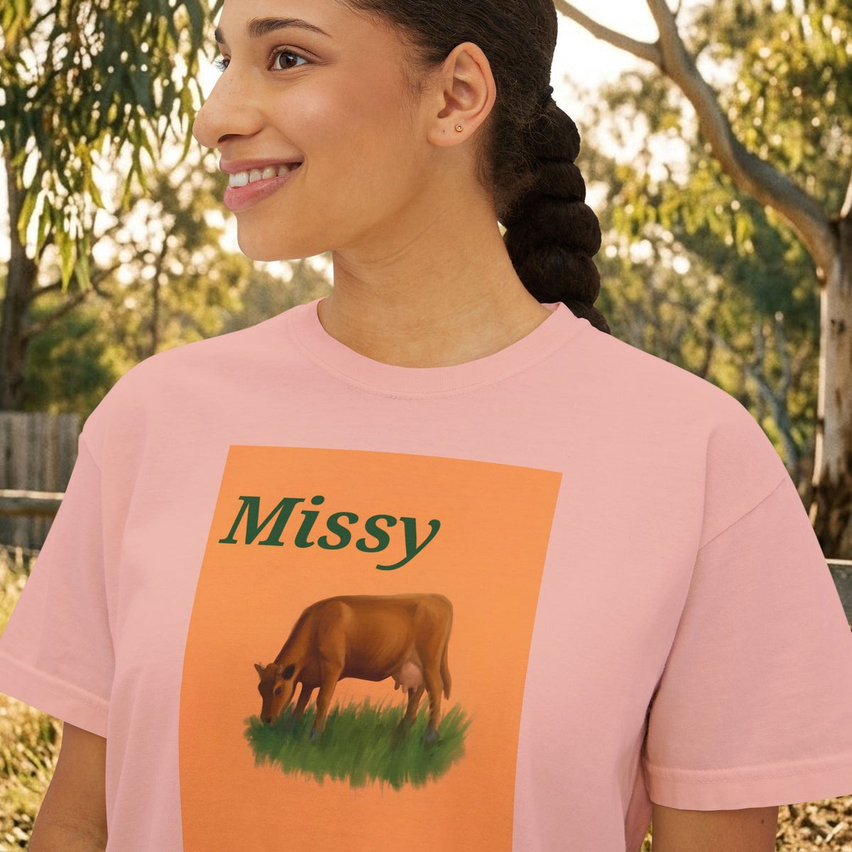 Women’s boxy graphic tee in pink with 'Missy' cow illustration on front