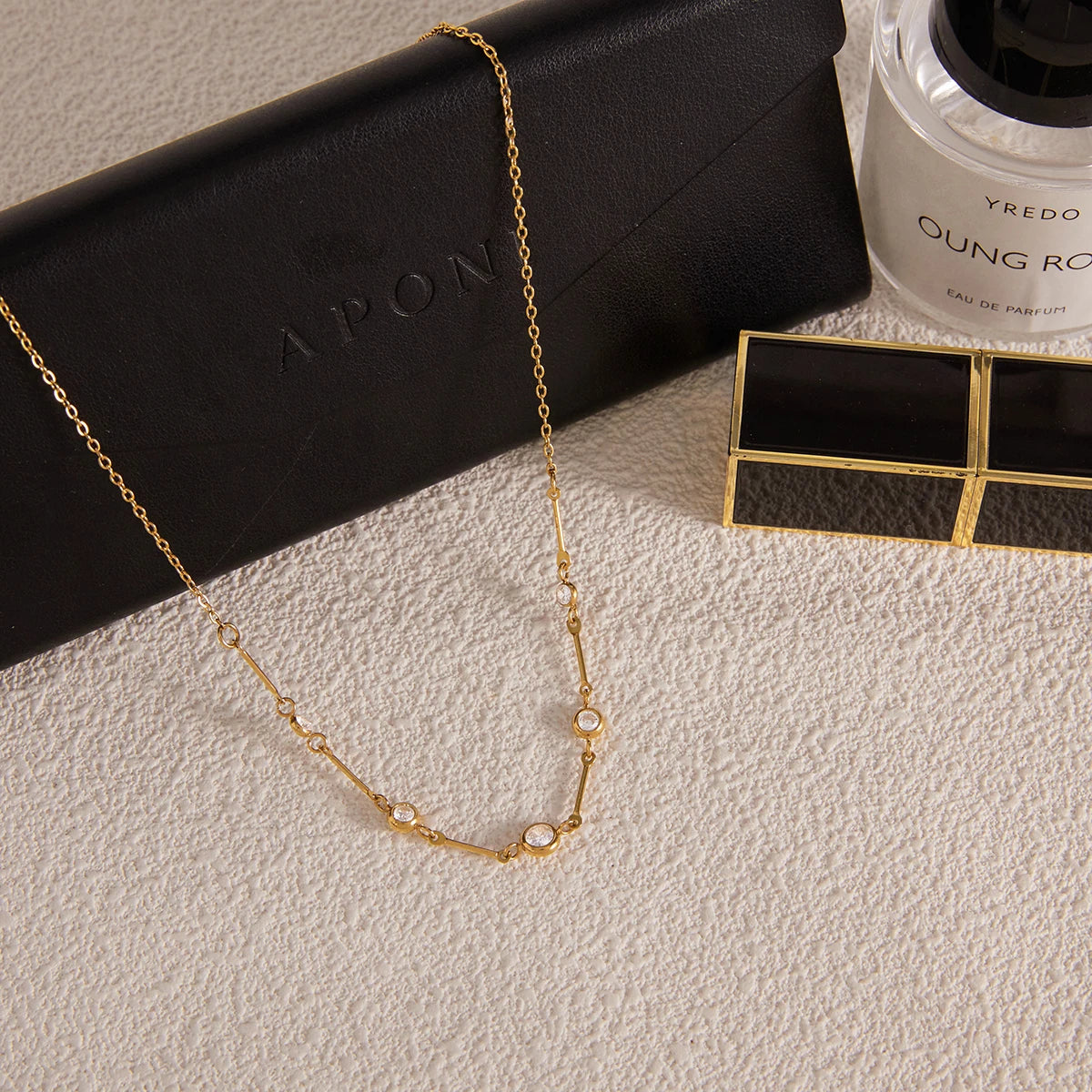 Gold layered zircon necklace by Kat&Co.