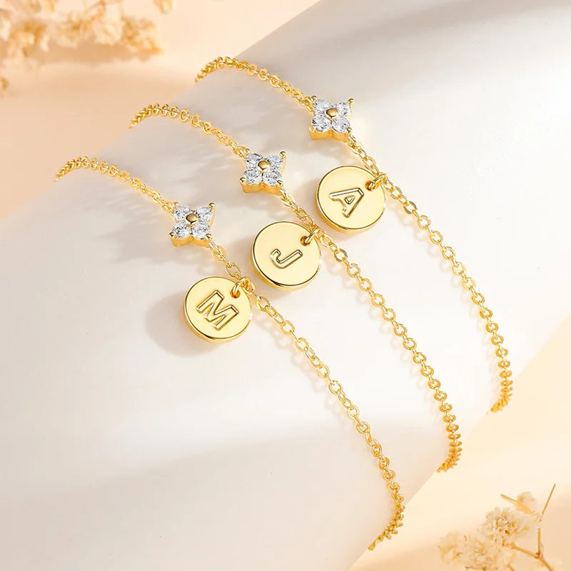 Gold clover initial bracelet with cubic zirconia by Kat&Co.