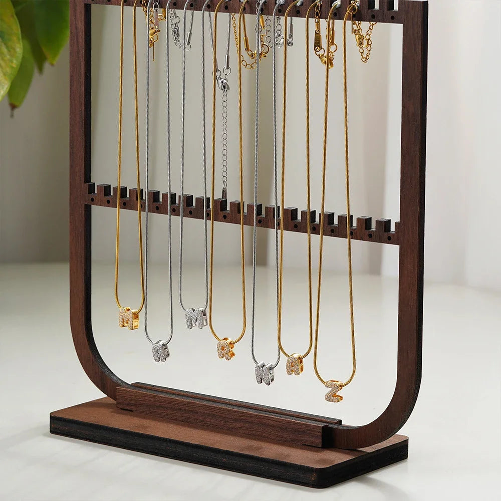 Dainty zircon initial letter necklace by Kat&Co.