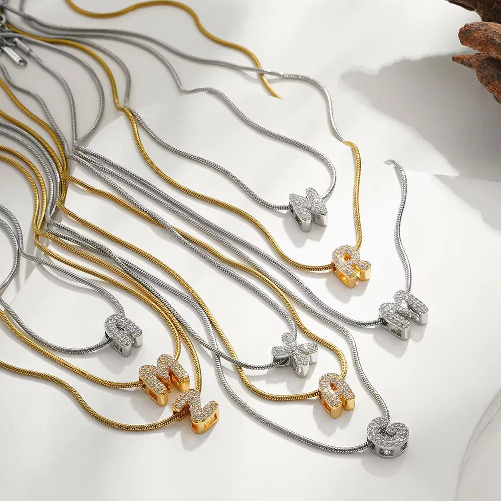 Dainty zircon initial letter necklace by Kat&Co.