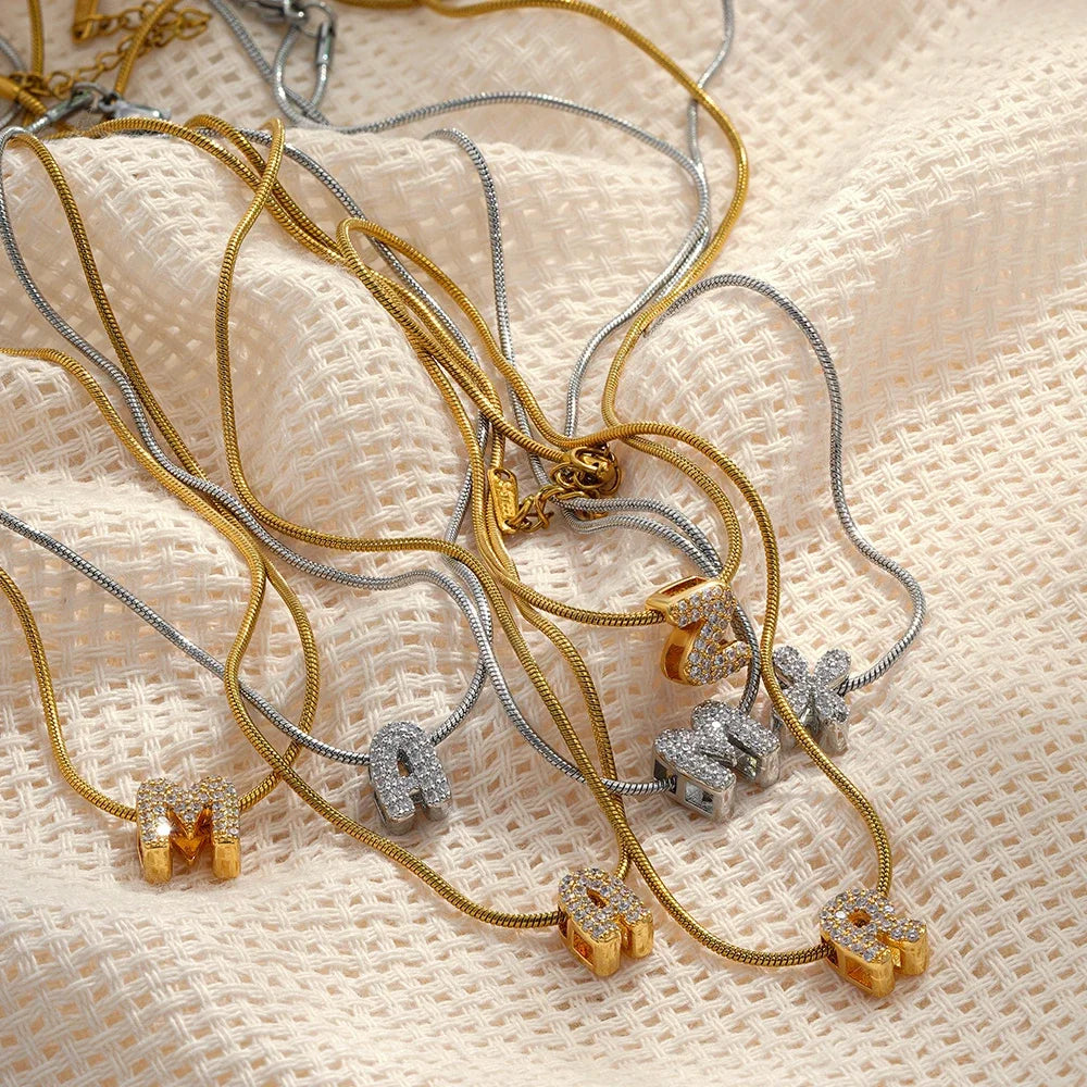 Dainty zircon initial letter necklace by Kat&Co.