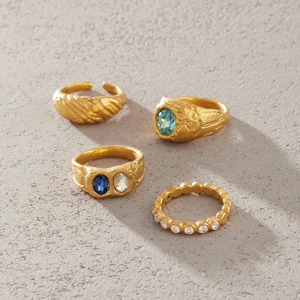 Gold chunky ring with blue crystal by Kat&Co.