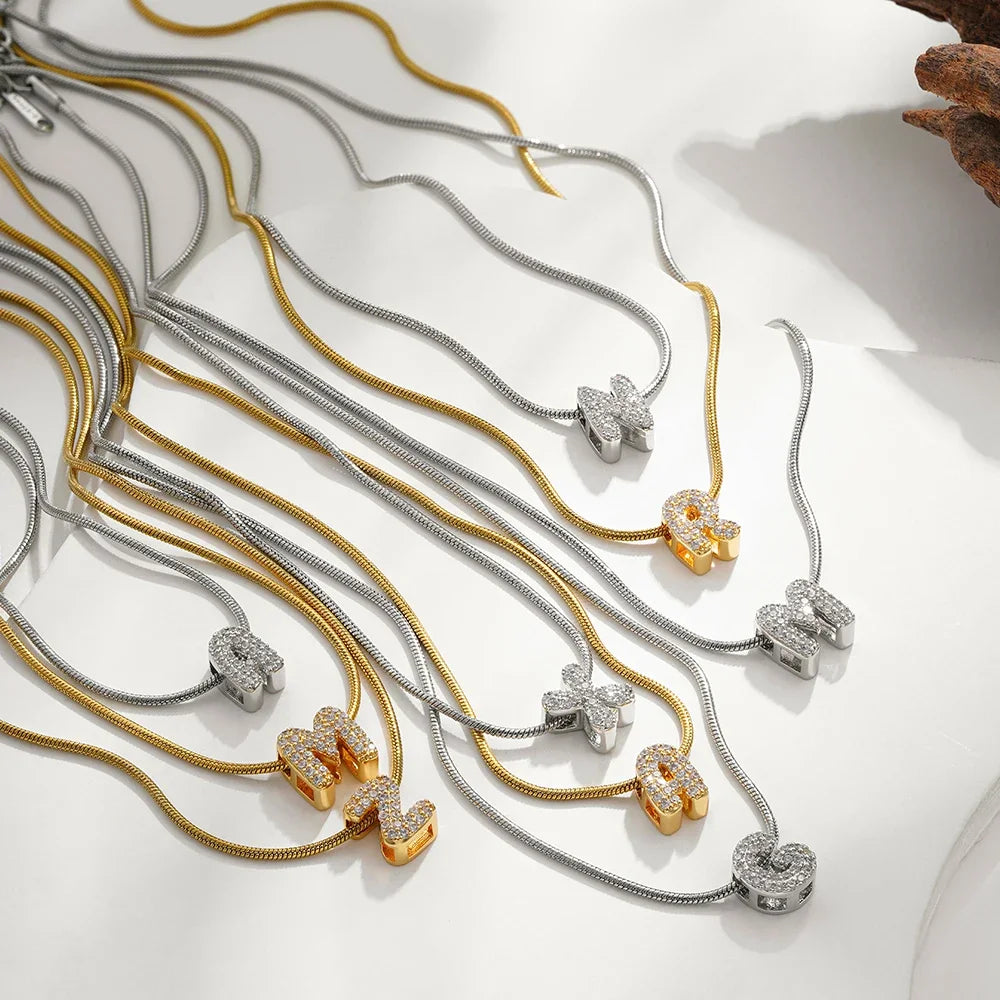 Dainty zircon initial letter necklace by Kat&Co.
