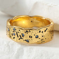 Gold wave texture statement ring with zircon by Kat&Co.