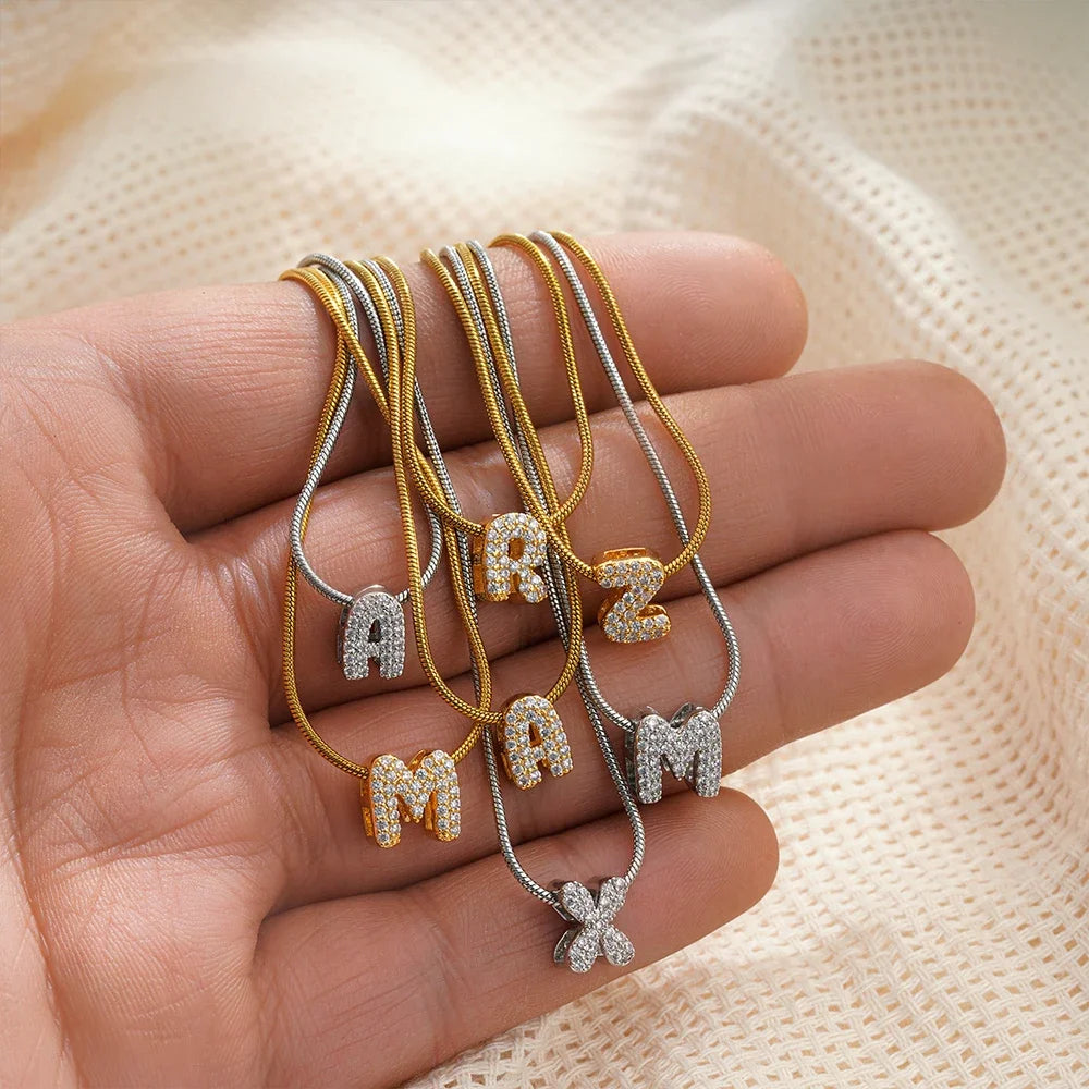 Dainty zircon initial letter necklace by Kat&Co.