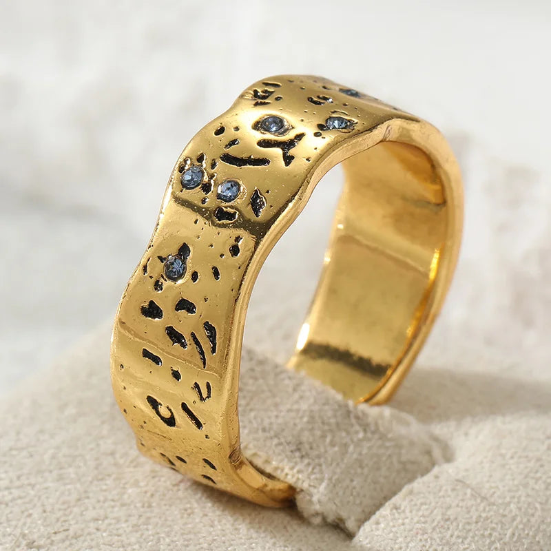 Gold wave texture statement ring with zircon by Kat&Co.