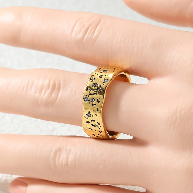 Gold wave texture statement ring with zircon by Kat&Co.