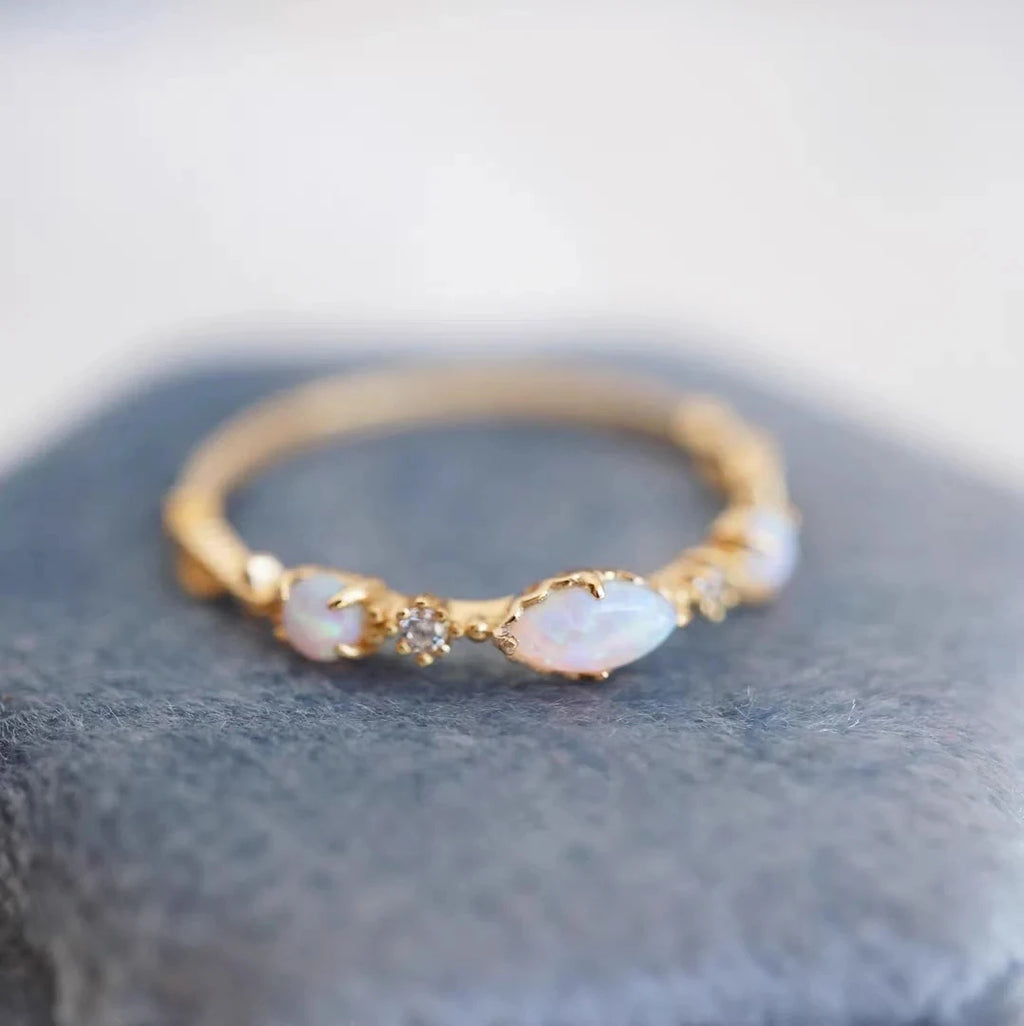 Blue apatite ring worn on hand