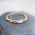 Blue apatite ring worn on hand