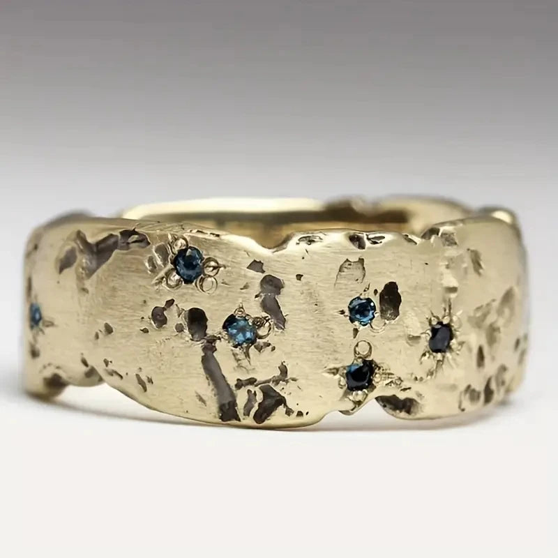 Gold wave texture statement ring with zircon by Kat&Co.