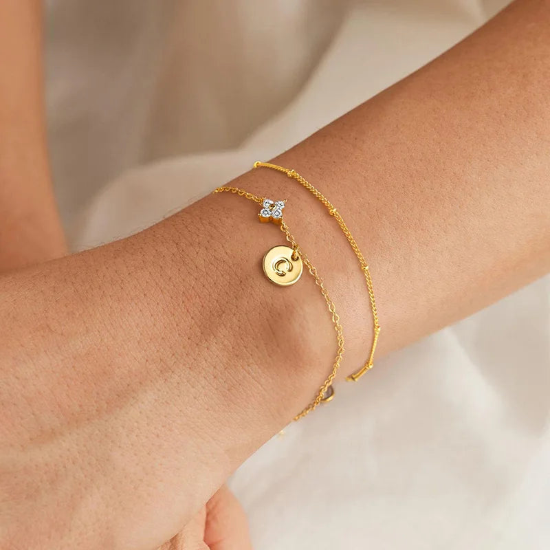 Gold clover initial bracelet with cubic zirconia by Kat&Co.
