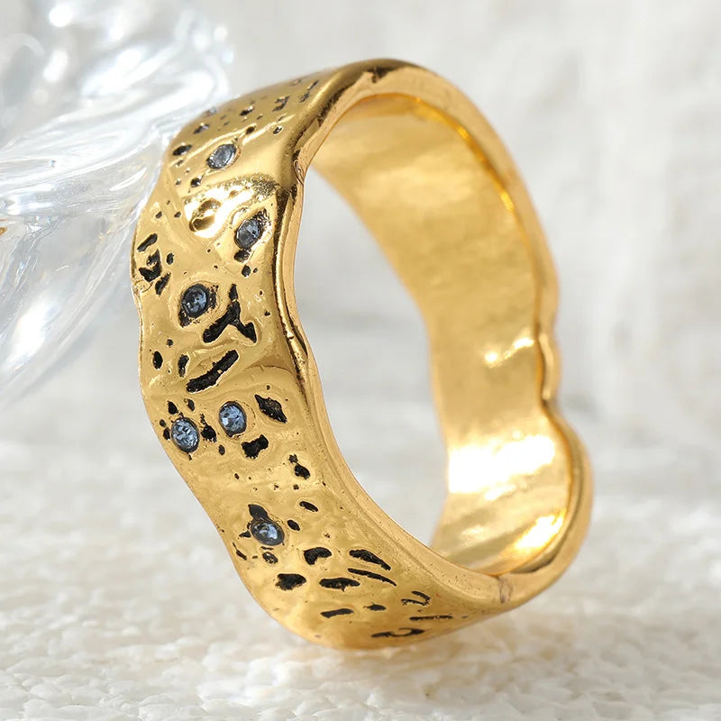 Gold wave texture statement ring with zircon by Kat&Co.